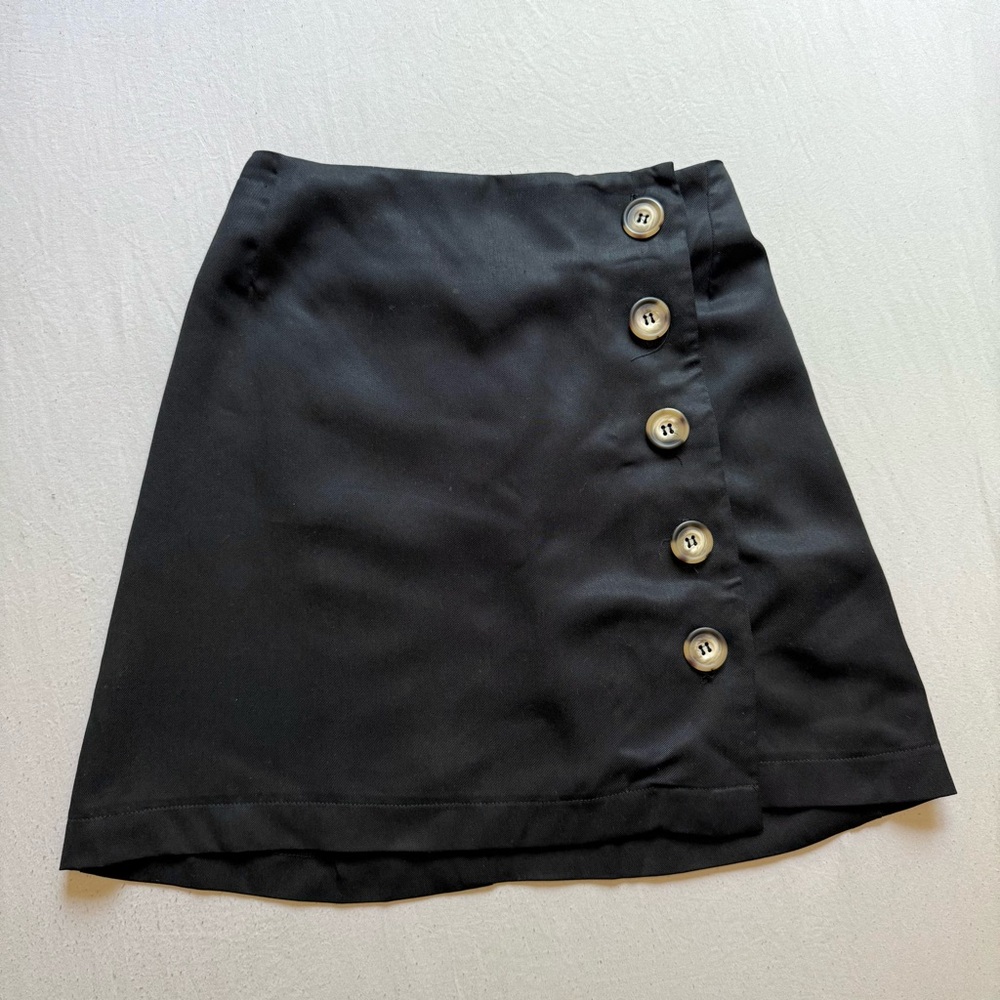 WHIMSY + ROW black recycled rayon tortoiseshell button up wrap style mini skirt